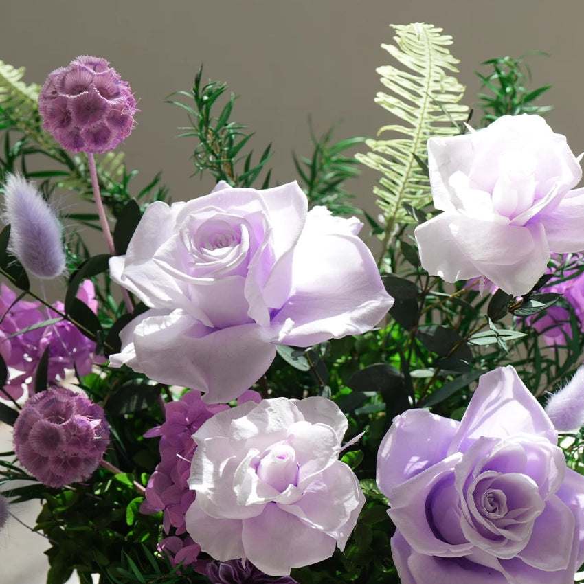 Detailed view of lavender preserved roses bouquet, elegant long-lasting floral decor