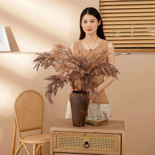 Artificial dried faux fern branches displayed in a tall vase for modern farmhouse decor and shop styling