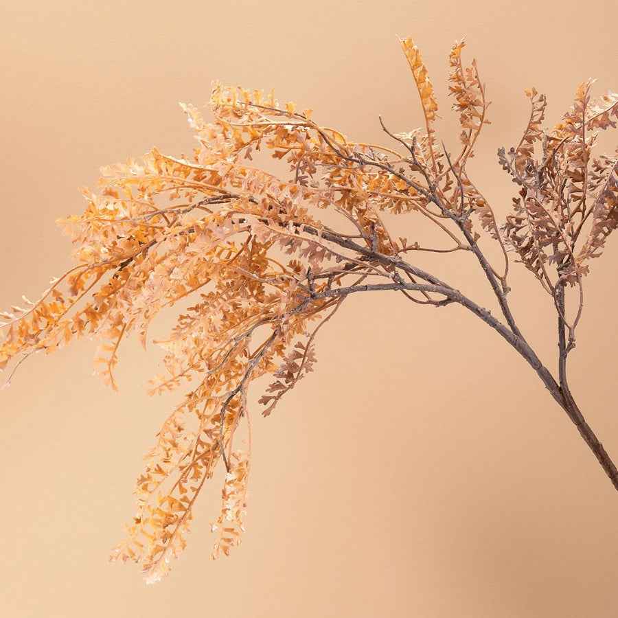 Beige artificial dried-look faux fern branch with airy foliage texture for rustic home decor and vase styling