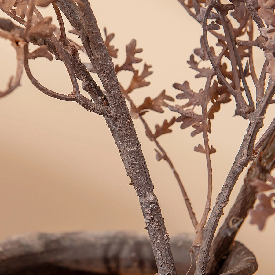 Close-up of realistic faux botanical stem with textured branches for artificial dried foliage decor