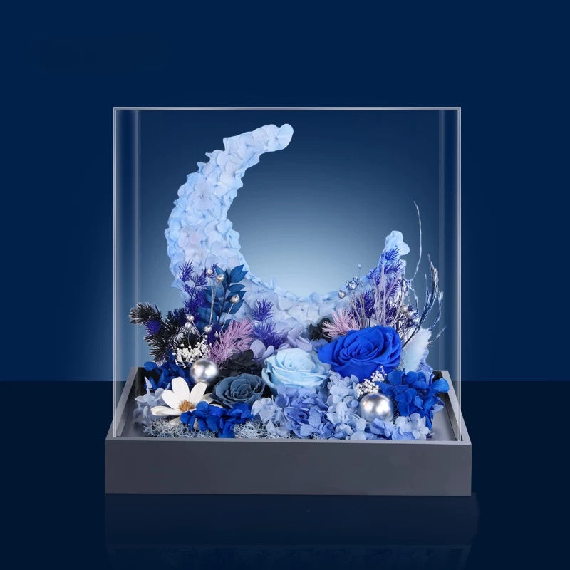 blue aurora preserved flower moon arrangement in acrylic cover, modern luxury floral centerpiece