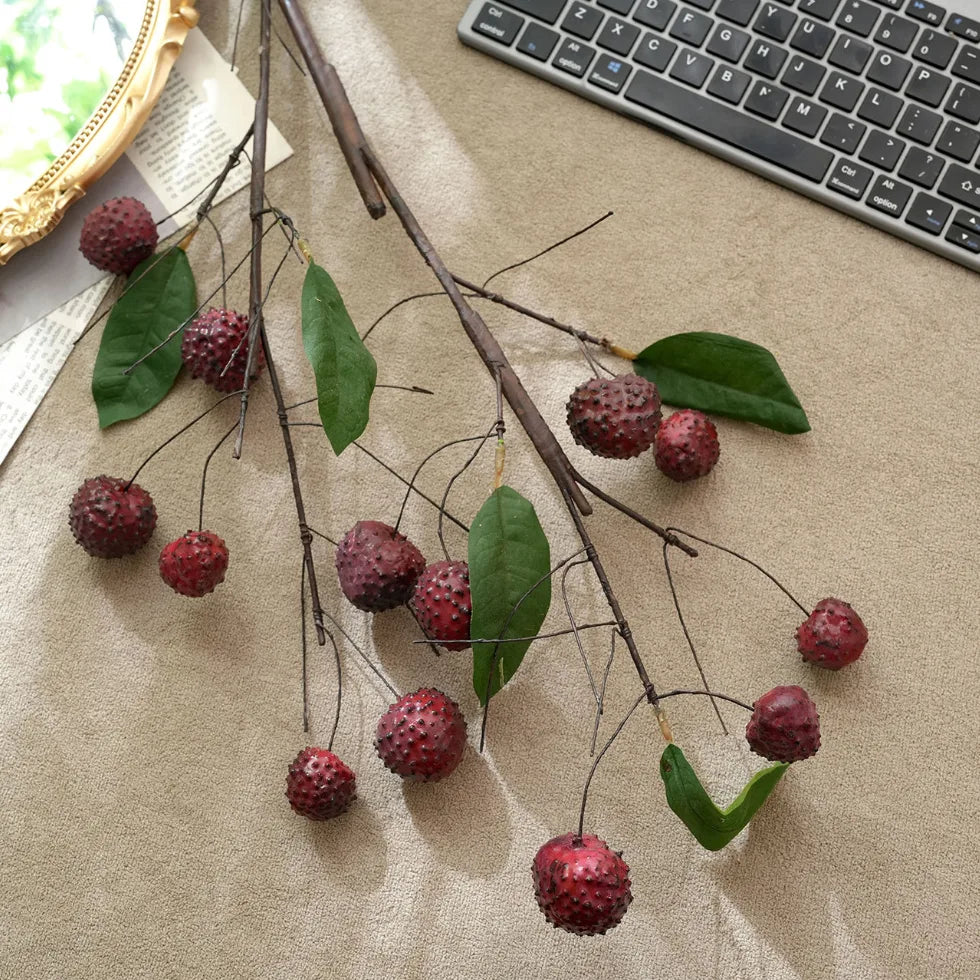 Vintage faux lychee branch with red fruit and green leaves for rustic botanical decor