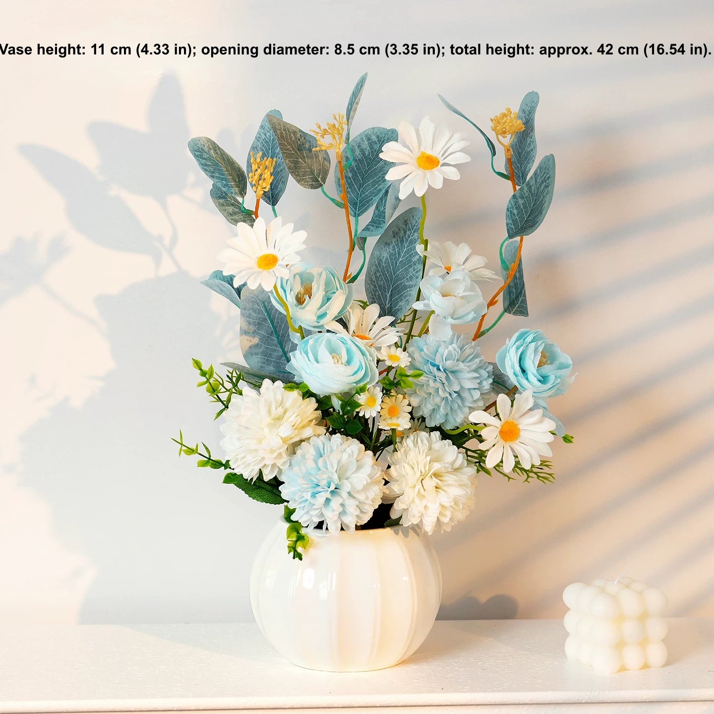 Blue and white artificial flower arrangement in white vase for tabletop decor