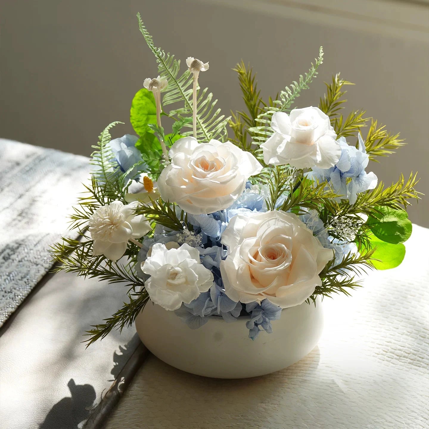 Premium preserved rose tabletop decor in champagne and blue tones, elegant home accent on table