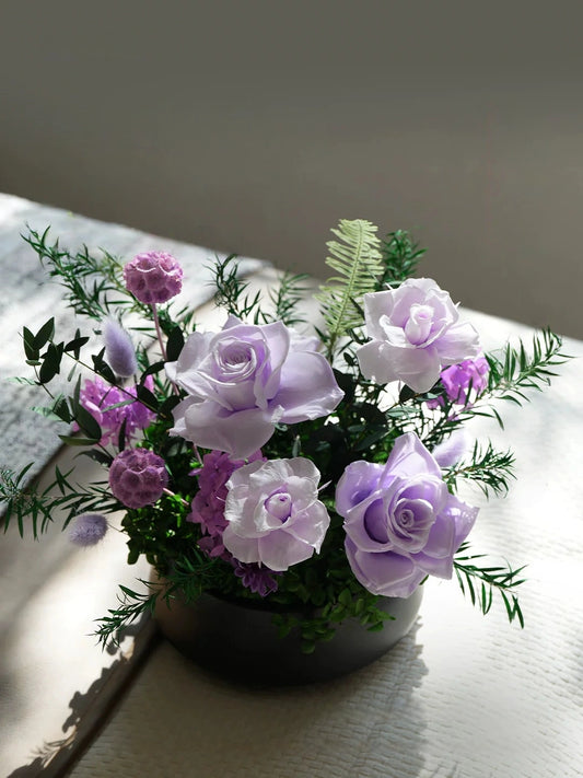 Lavender purple preserved rose bouquet, stylish tabletop decor with natural light