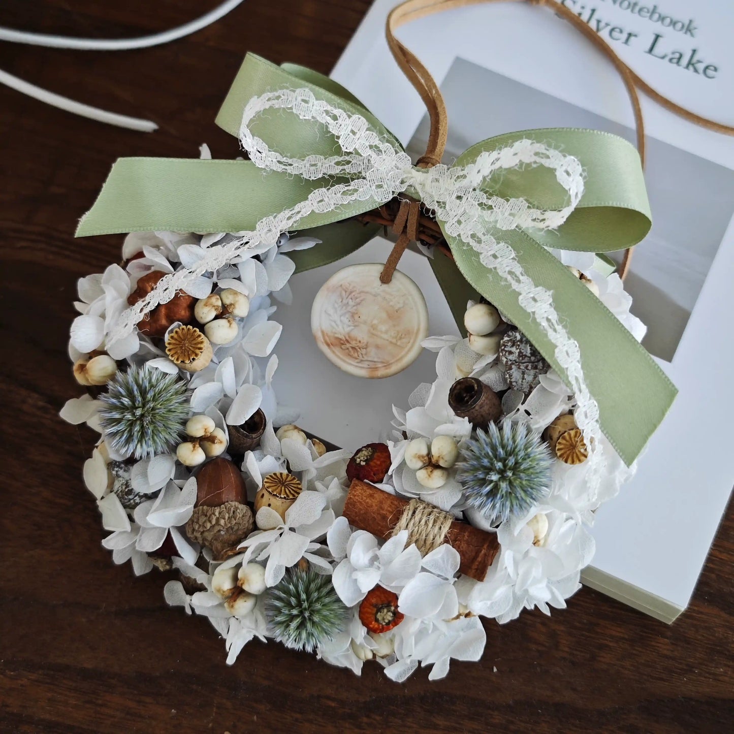 Rustic white dried botanical preserved flower wreath with green bow for home decor
