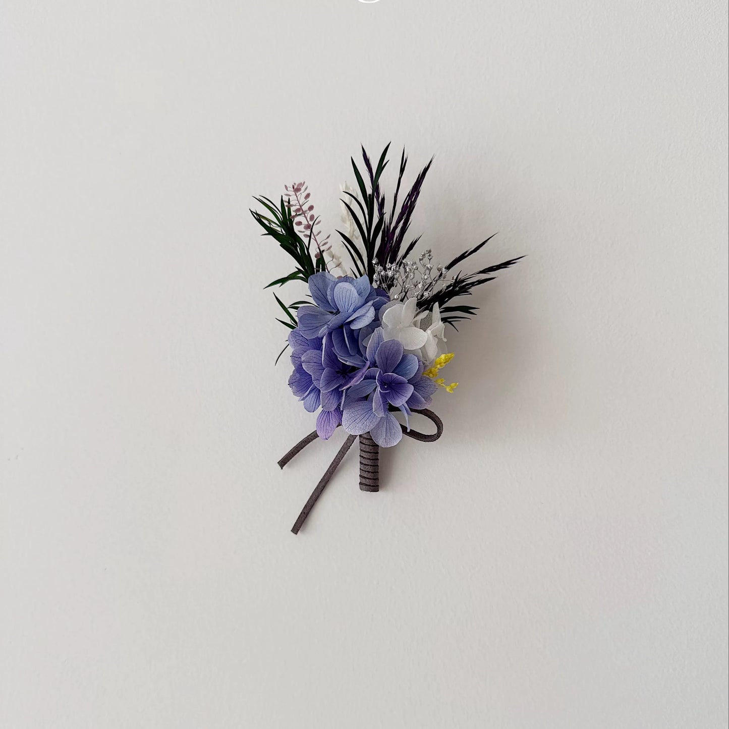 Purple hydrangea boutonniere with preserved flowers for wedding groom accessory