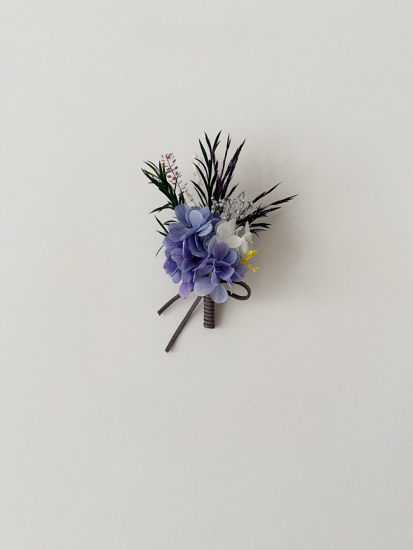 Purple preserved flower boutonniere with hydrangea for wedding suit decor