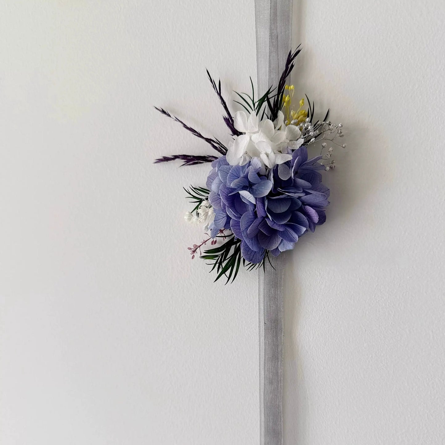 Purple hydrangea wrist corsage with preserved flowers for wedding bridesmaids