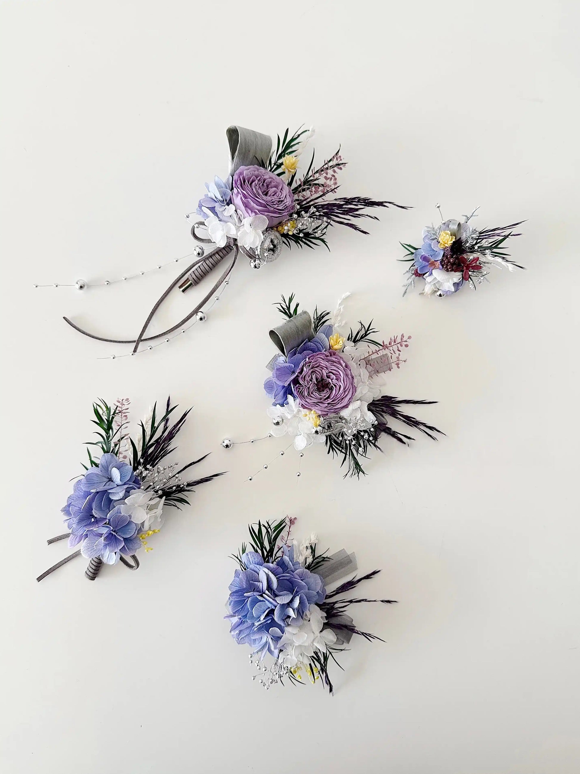 Purple preserved flower wedding corsage and boutonniere set for bridesmaids