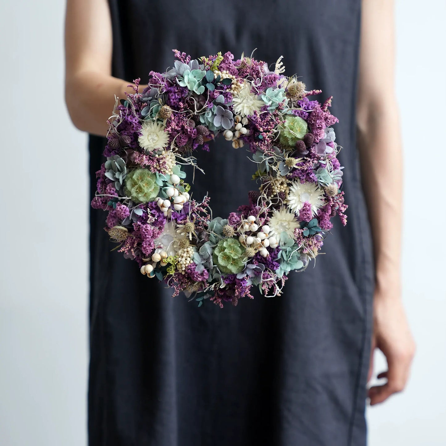 Elegant purple preserved floral wreath for door hanging, perfect for home, wall, or dining table decoration.