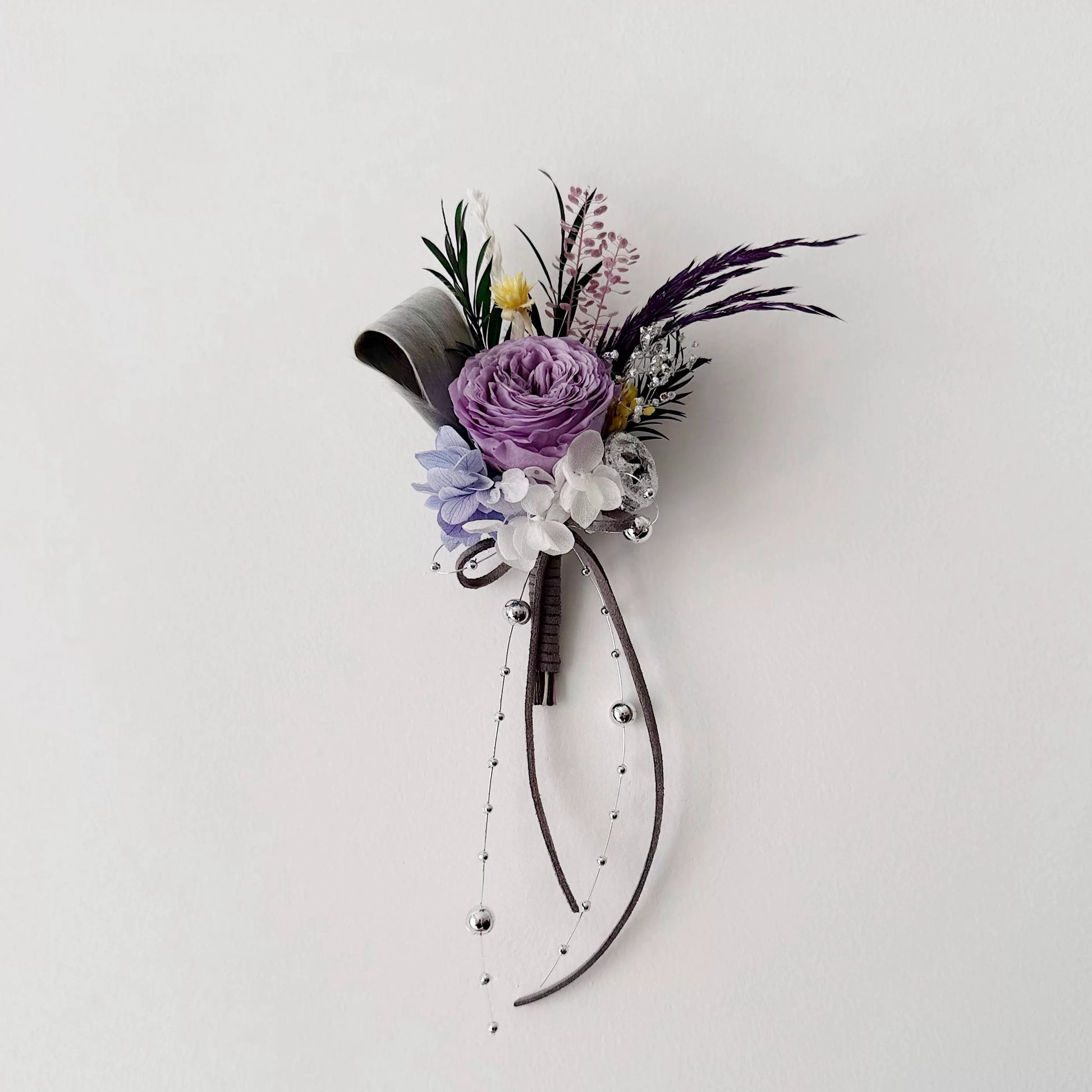 Purple preserved rose boutonniere with ribbon for groom wedding accessory