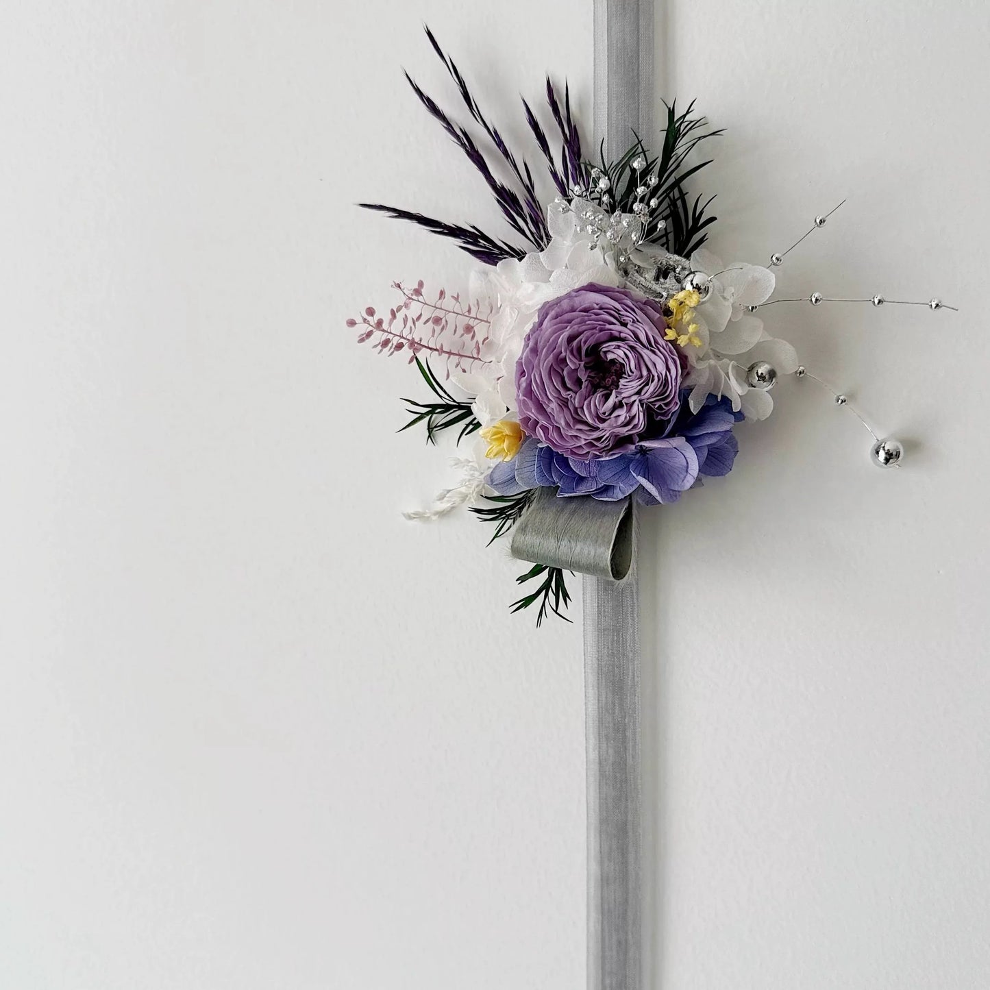 Purple preserved rose wrist corsage with hydrangea for wedding bridesmaid