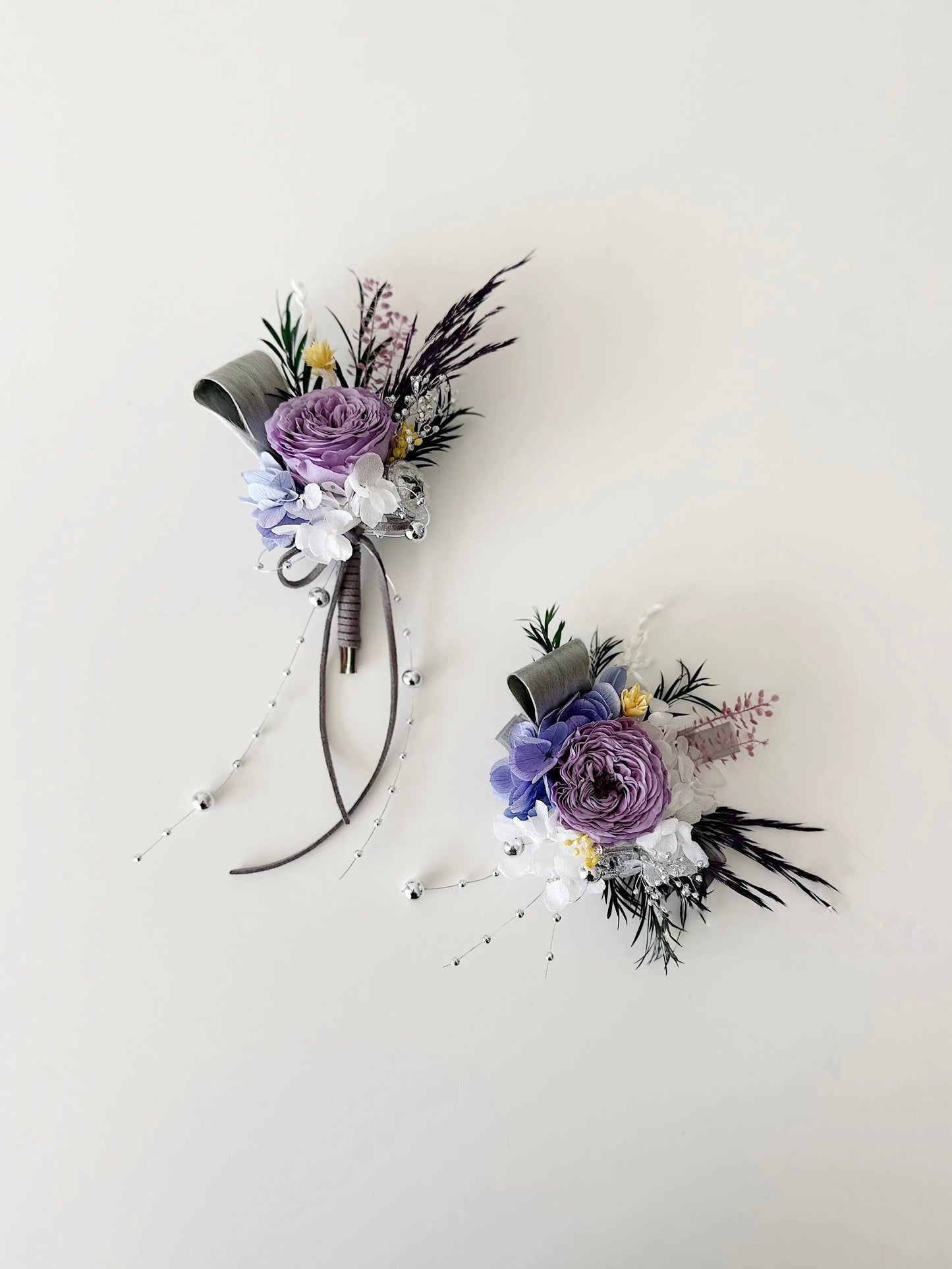 Elegant purple preserved flower corsage and boutonniere set for weddings