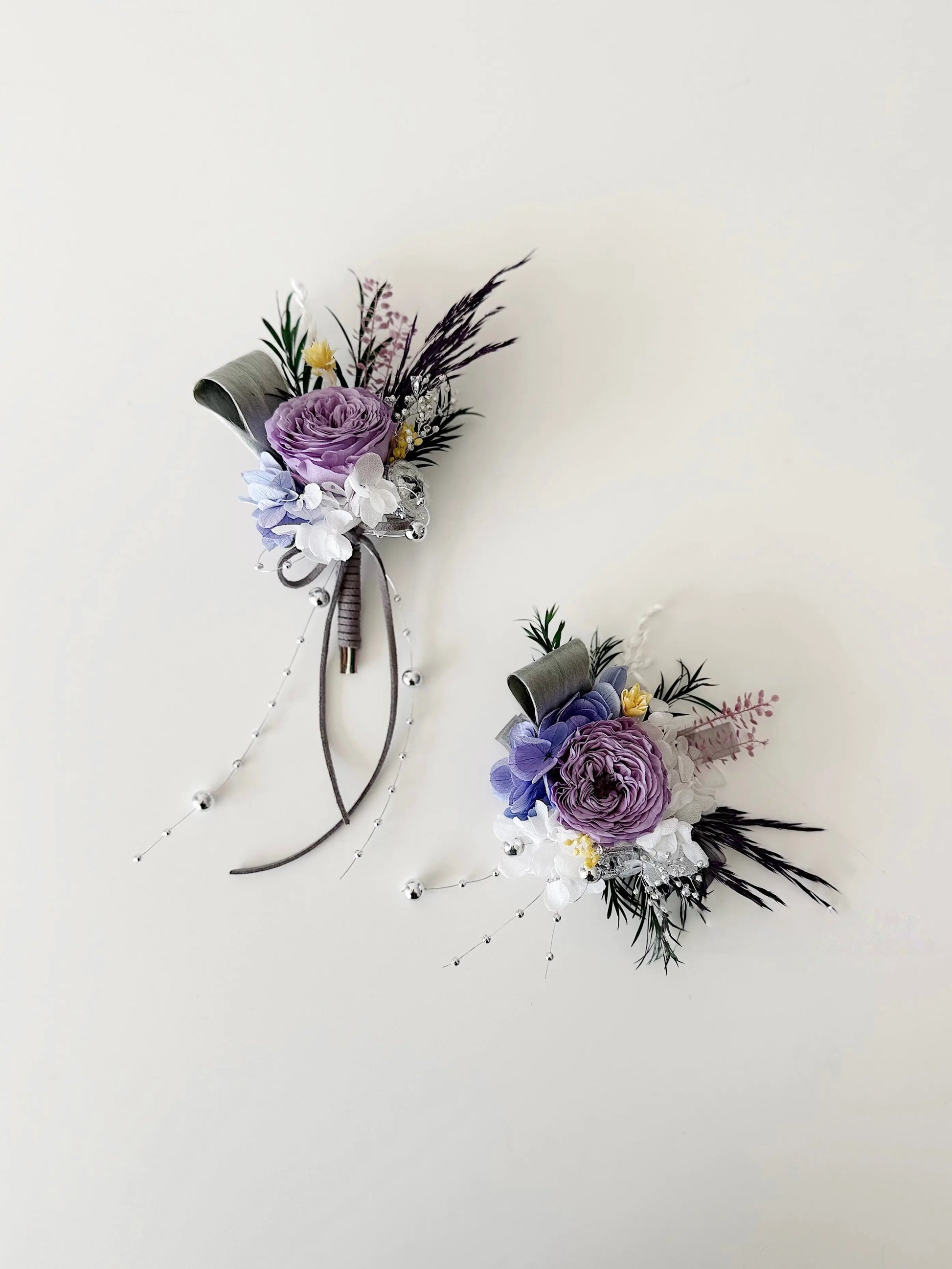 Elegant purple preserved flower corsage and boutonniere set for weddings