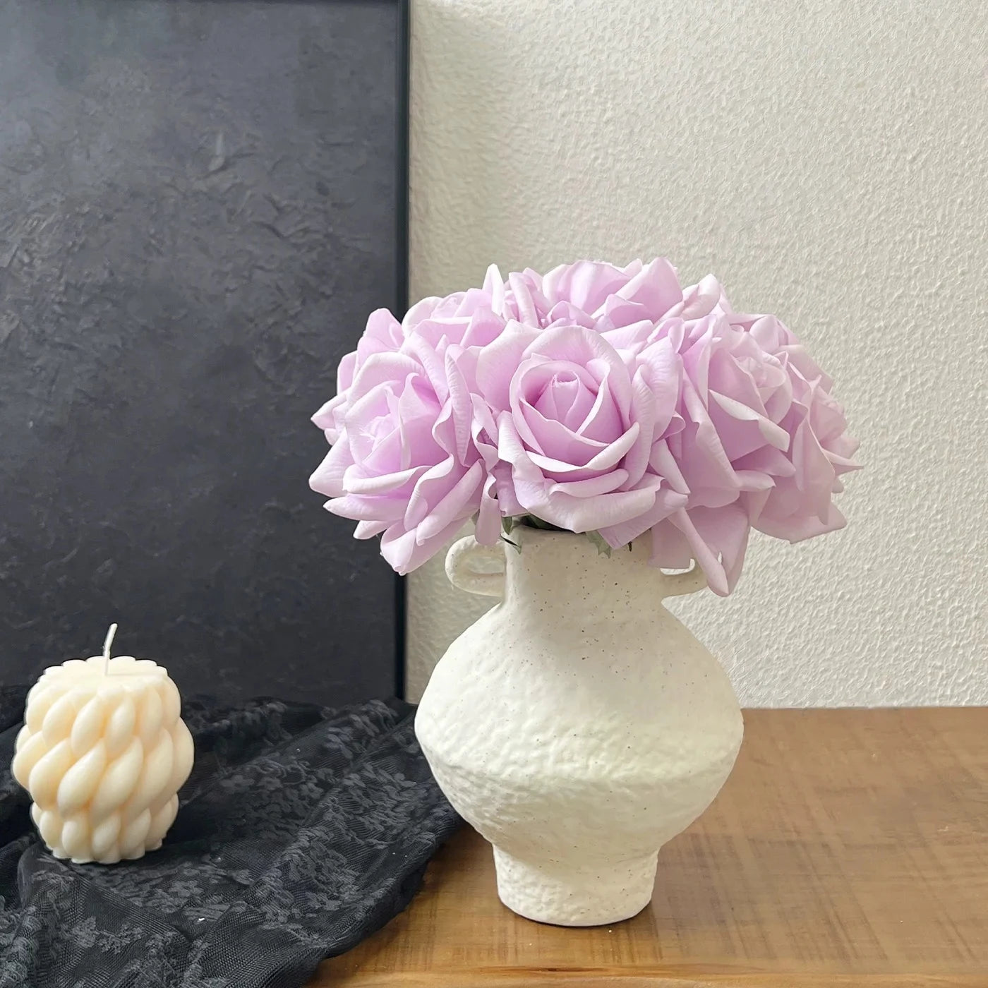 Light purple faux rose bouquet in vase for modern table decoration