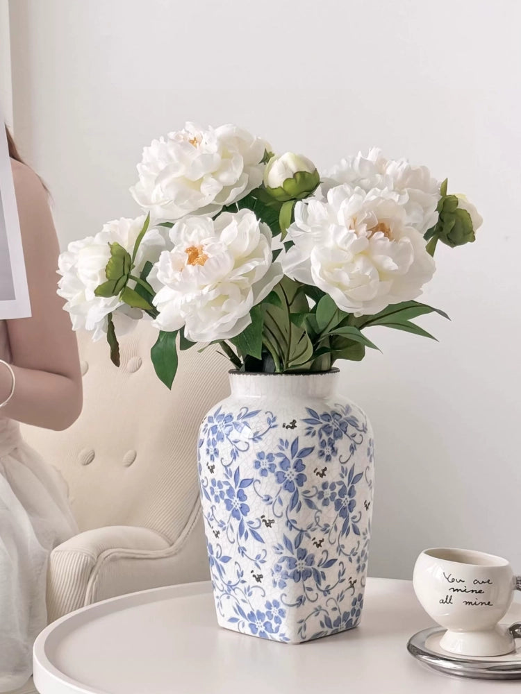 Elegant peony artificial flower arrangement on side table with teacup