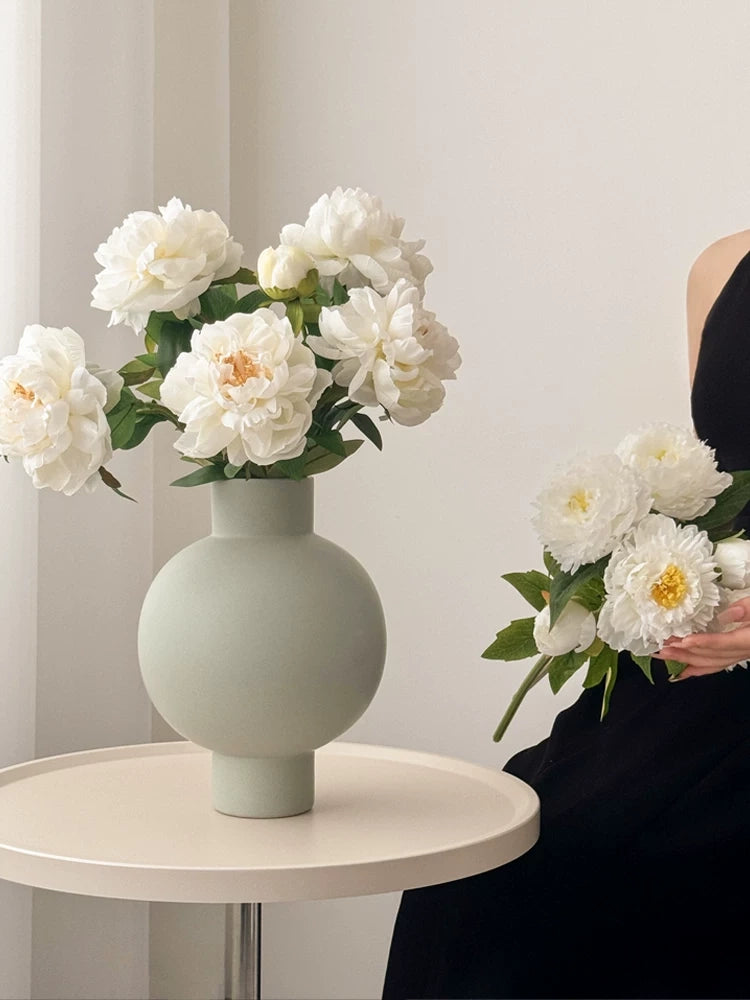 White peony faux flower bouquet in modern vase for minimalist home styling